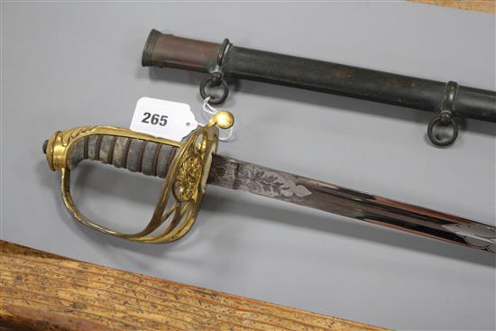 A Victorian infantry officers sword, the polished etched blade by J.B. Johnstone, gilt hilt and brass scabbard, blade 84cm, overall le